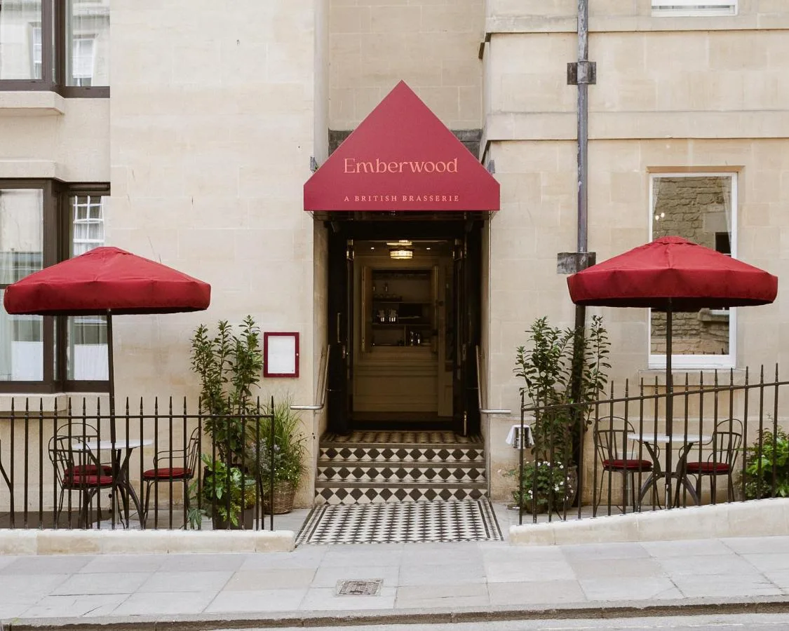 a entrance to a building with red umbrellas at Francis Hotel Bath in Bath