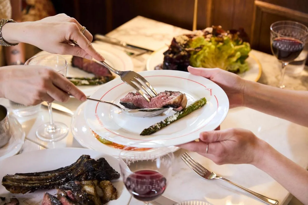 a group of people sitting at a table with a plate of food at Francis Hotel Bath in Bath